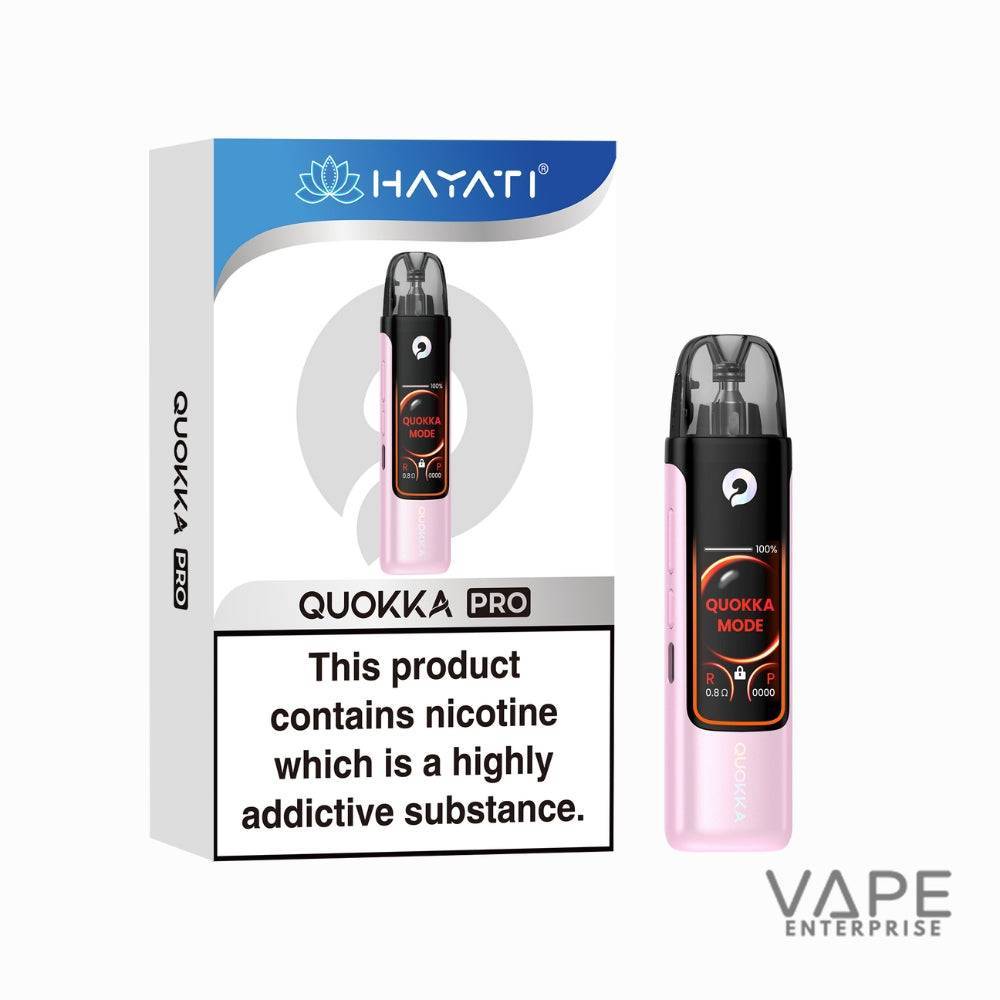 Baby pink QUOKKA Pro vape device with digital display showing QUOKKA Mode, next to its box warning about nicotine addiction