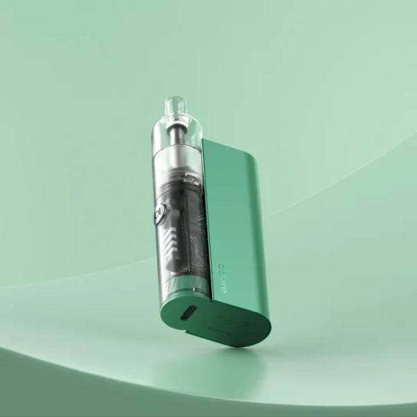 Mint green vape device with transparent cartridge on curved green surface