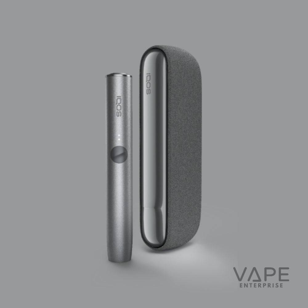 IQOS Iluma Pebble Grey starter kit vape device with sleek metallic finish on gray background