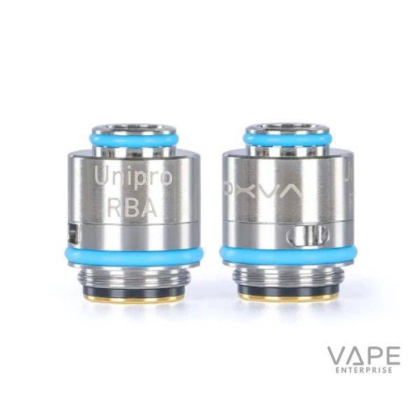 Two stainless steel OXVA Unipro RBA coils with blue silicone rings and gold-plated bases on white background