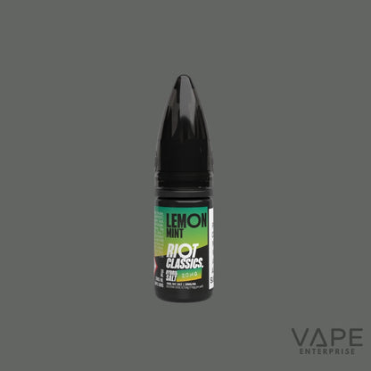 Vape juice bottle labeled 'Lemon Mint' by 'Riot Classics' on a gray background